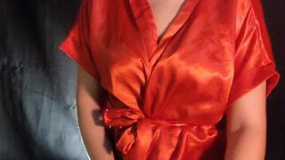 Smoking inhaling cigar wearing satin robe with all sensualidade that cigar deserves