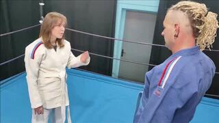 Girl in white gi vs guy in blue gi