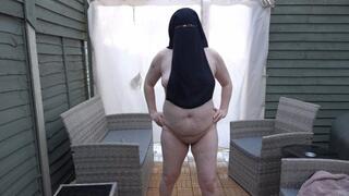 Naked in strappy high heels wearing only Niqab outdoors