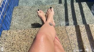 in the pool showing off her beautiful feet