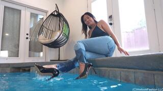 Reyna swimming in the Pool wearing Jeans, Heels and a Swimsuit