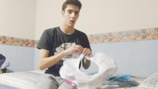 Male Looner Blowing Up an Inflatable feather and Riding it