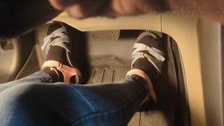 Fifi cranking her sedan in sandals with black socks replay
