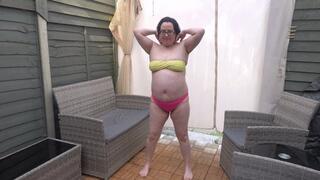 Raven hair wife stripping in yellow and pink bikinid