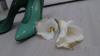 I stomped and crushed two white flowers with green shoes a