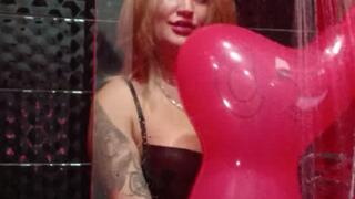 Blow red balloon in shower