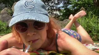 Barefoot smoke in the park