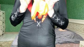 Alla pumps two heart-shaped balloons in red and transparent colors until they burst