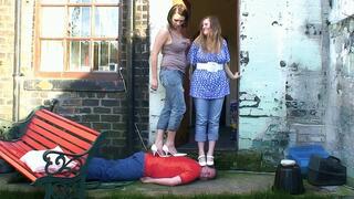 2 Girls Trampling Heels In The Garden Until His Face Goes Purple (4K)