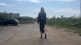 girl in high heels found a mattress and wants to tear it up with her heels, changing her shoes for thisG