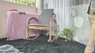 Dominatrix cross-legged and high heels dangling from her feet(2)