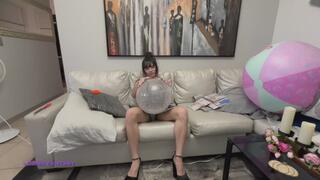 Owllete blows and plays with 2 balloons