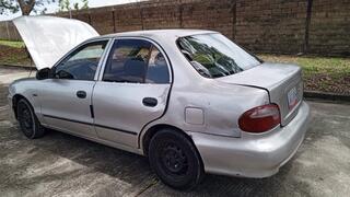 Using tools with my hands and some tights on my feet, I repair my car and pump its pedal (3)