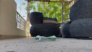 Crushing filled plastic bottle with dirty feet and my butt