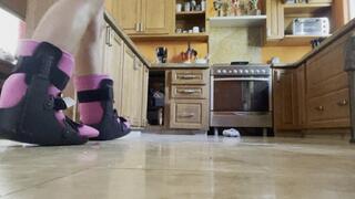 Topless with double ankle braces in the kitchen