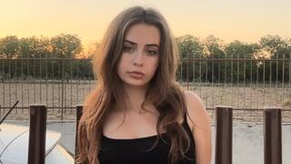 Smoking a cork cigarette in my long black dress before I go out for dinner!