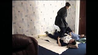 Fun Girl Tramples Her Two Slaves