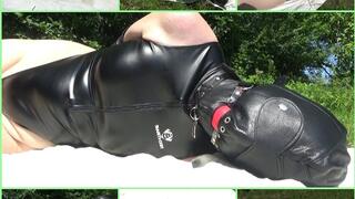 Handcuffed and hooded wife in a rubberized swimsuit
