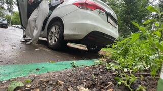 girl rocks the car from side to side, the car bumper bounces and shakes