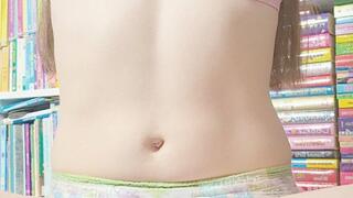 Tinylittlebabyg ties up her long brown hair into plaits before showing off her outfit, if you can call it that!