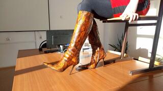 Hot long-legged hottie in high heels dancing on the table