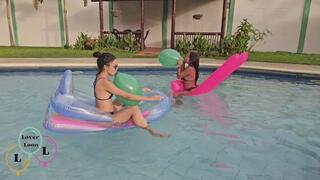 Marianna and Carmen have fun with their balloons and inflatables in the pool