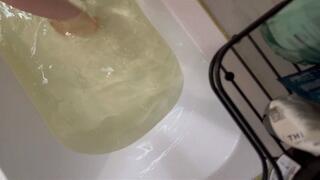 Emma in a dress holding her breath in the bath