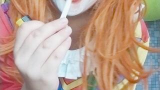 clowngirl poping balloons with cigarette