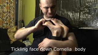 Tickling face down Cornelia body