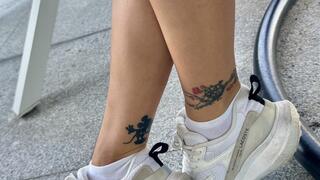 Sporty tanned leg shake under the table