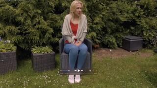 Aston Wilde wets her jeans in the garden