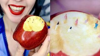 The giantess Snow White and the tiny dwarfs in the apple