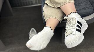 Candid sneaker removal and shoeplay on the busy train with an itchy foot