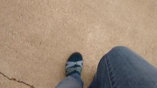 Fifi pedal pumping in Teva hiking sandals with socks and blue jeans replay