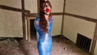 Redhead stuck in full body pallet wrap