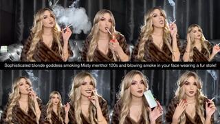 Sophisticated blonde Goddess smoking Misty menthol 120s and blowing smoke in your face wearing a fur stole!