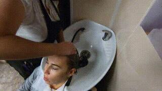 Hair washing in salon in leather pants