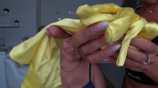 Yellow silk gloves on the neck and around the mouth of a blonde woman aN