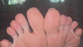 Toe curling and spreading in red polish