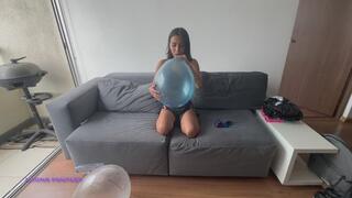 Akina blows balloons