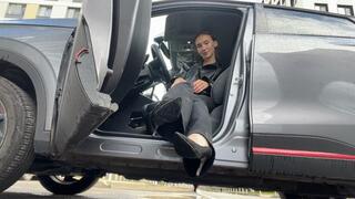 A girl in high-heeled shoes plays with the pedals of a car, first-person and cameraman video