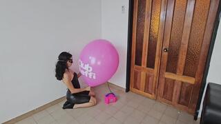Marianna blows to pop her big pink TIFFANY balloon!