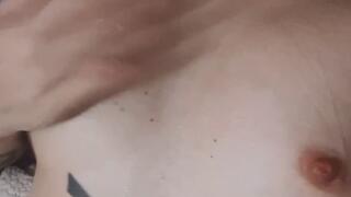 Fairy skin tattooed girl covering her big boobs in saliva