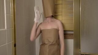 Paper bags and knee high socks in the shower getting wet