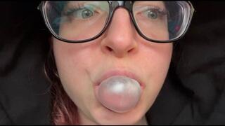 Emma makes bubble gum bubbles in a taxi