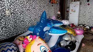 riding on inflatable whale in pool