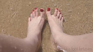 Fifi showing off her feet in the sand and waves at the beach replay
