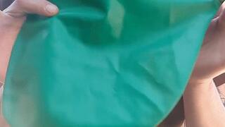 Blowing a Big Green Balloon