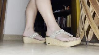 Crusty feet walking in clunky wooden sandals