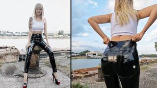 Anastasia walking outdoors in her creaky pvc leggings